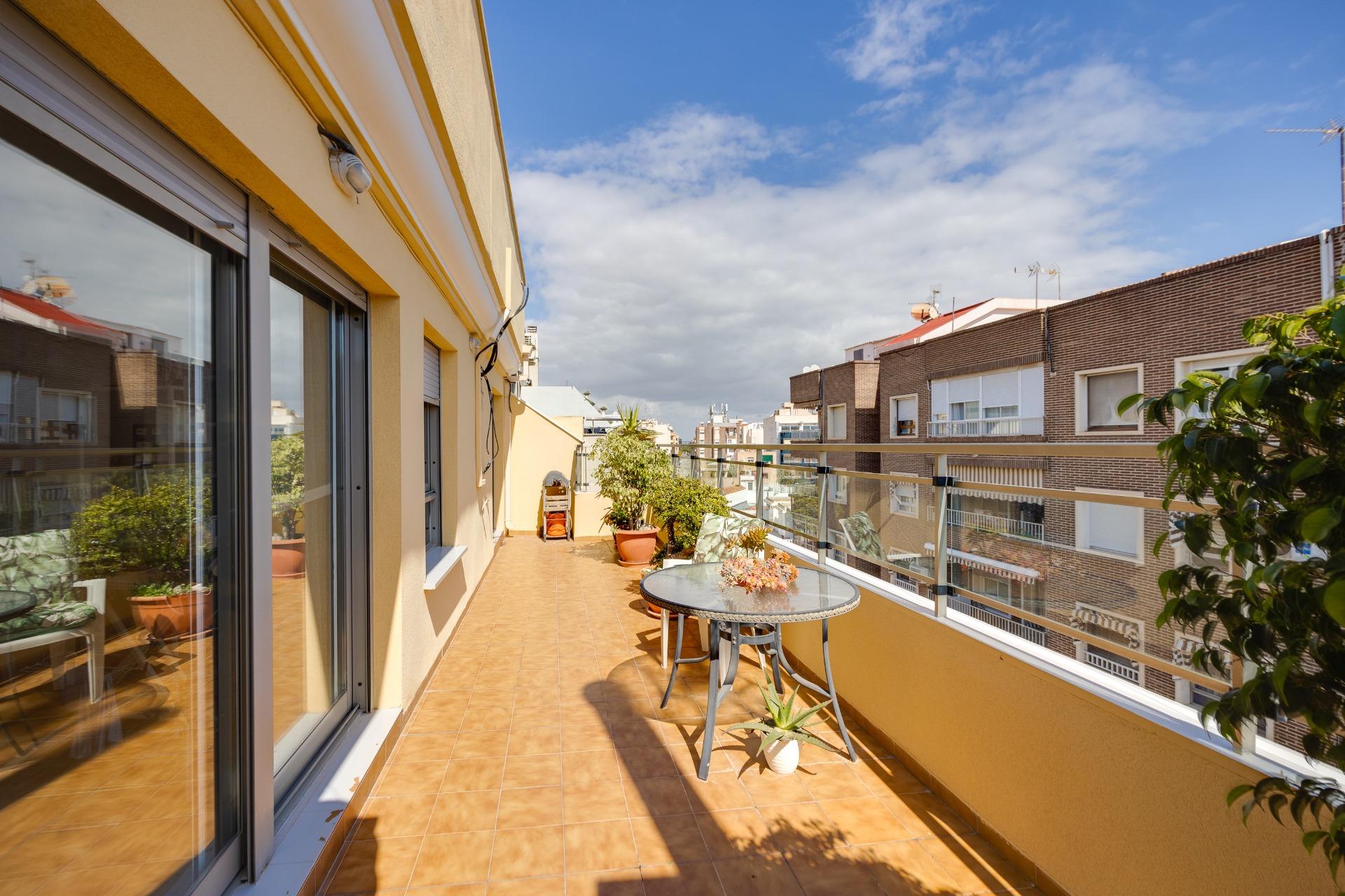 This penthouse, located on the fifth floor with an elevator, offers a prime location right in the ce