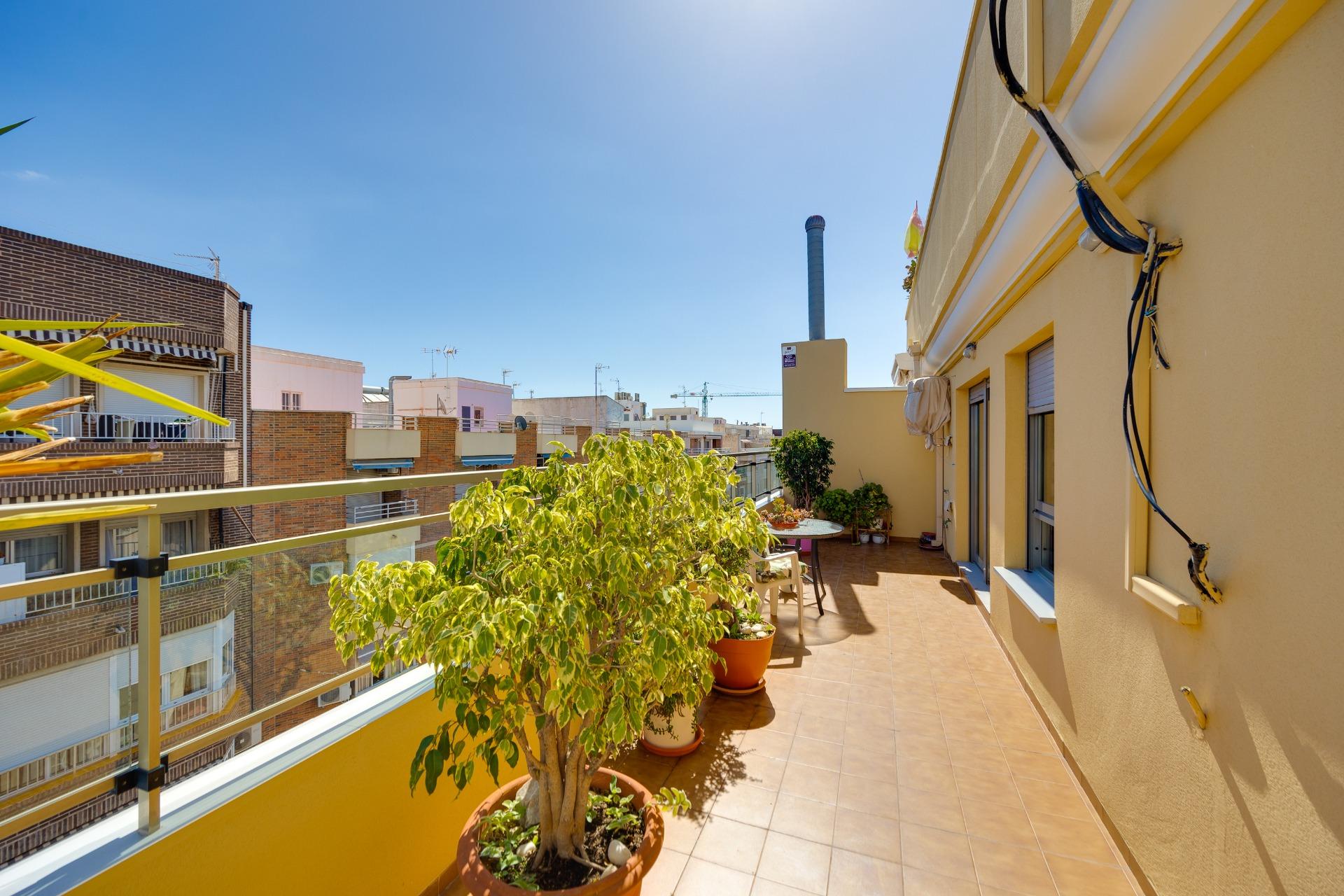 This penthouse, located on the fifth floor with an elevator, offers a prime location right in the ce