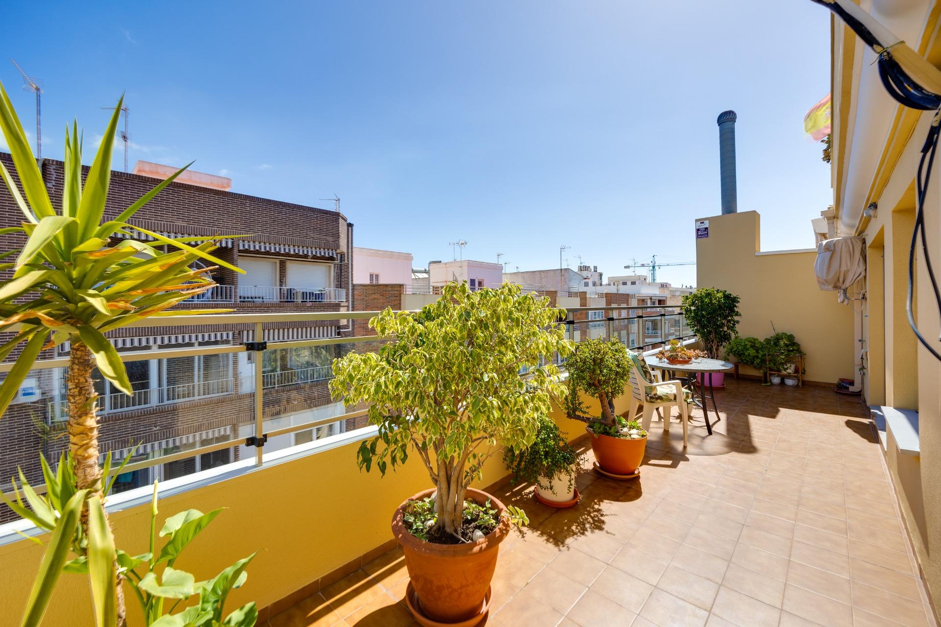 This penthouse, located on the fifth floor with an elevator, offers a prime location right in the ce