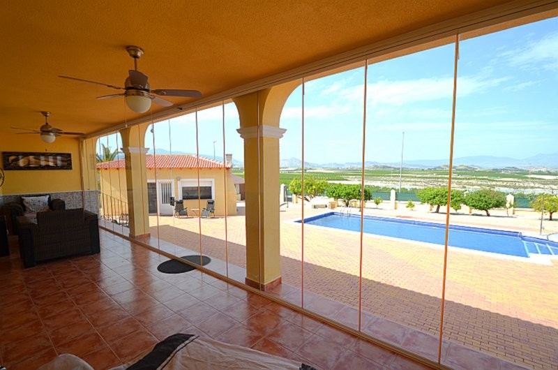 Pool area in villa for sale in Campos del Río
