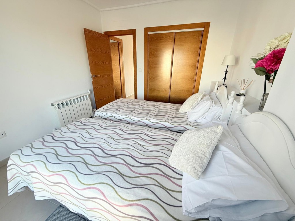 Master bedroom in apartment for sale in Hacienda Riquelme Golf Resort