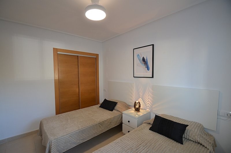 Master bedroom in apartment for sale in Hacienda Riquelme Golf Resort
