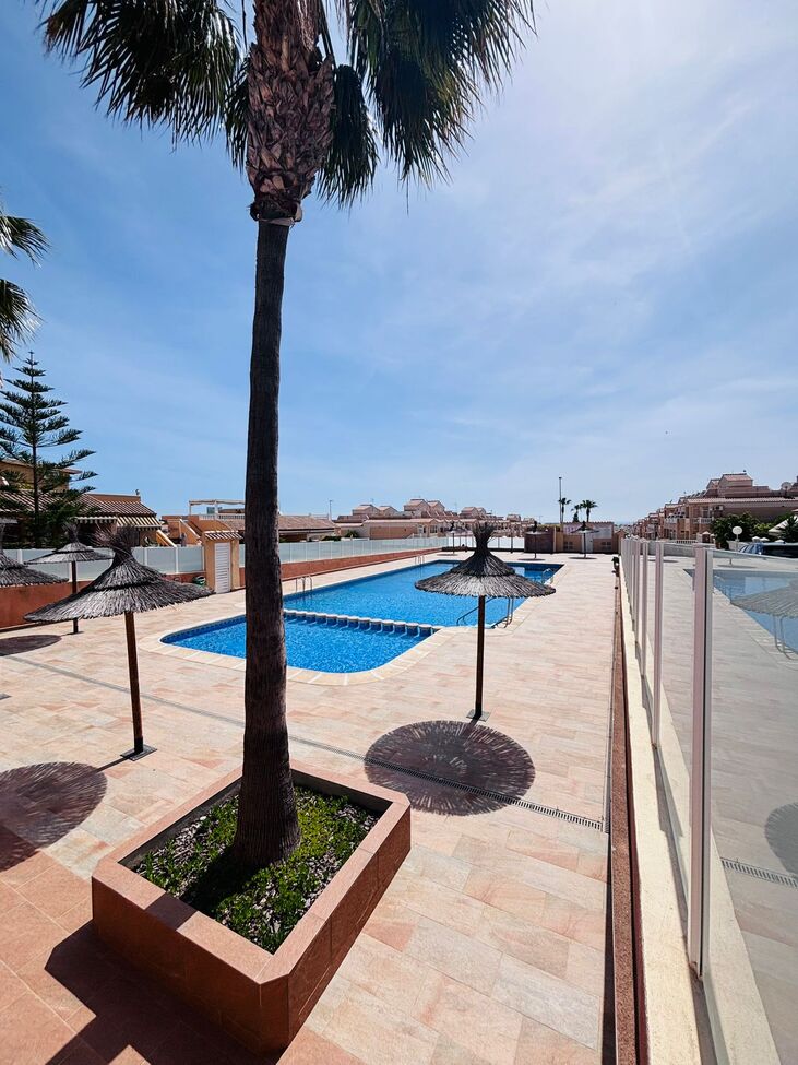 Pool area in apartment for sale in Punta Prima
