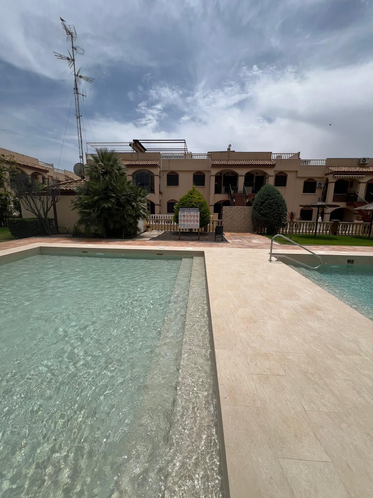 Pool area in bungalow for sale in Torrevieja