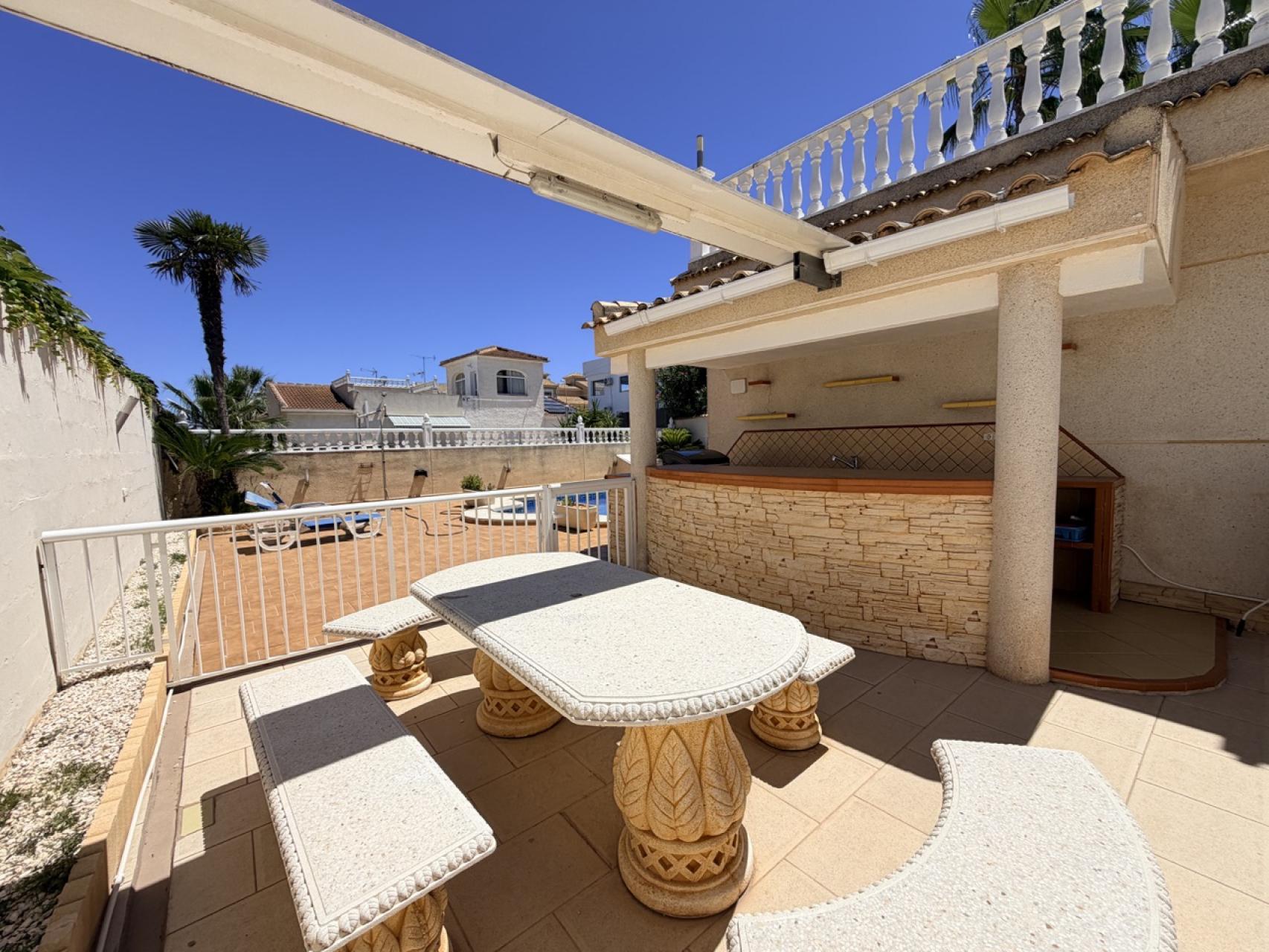Pool area in villa for sale in Torrevieja