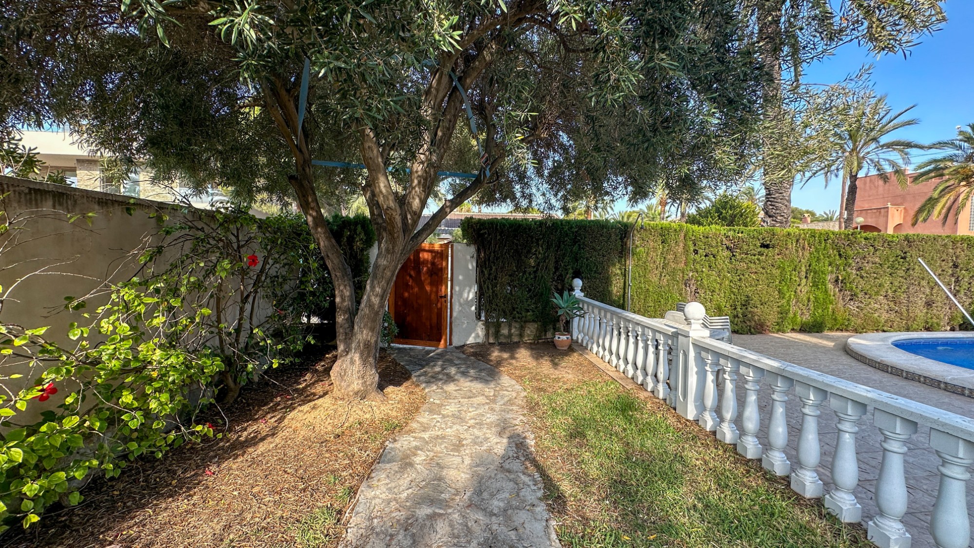 Pool area in villa for sale in Cabo Roig