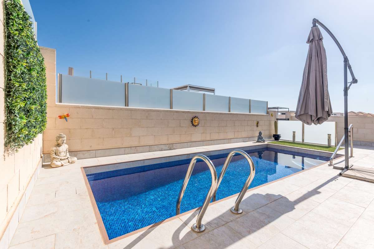 Pool area in villa for sale in Orihuela Costa
