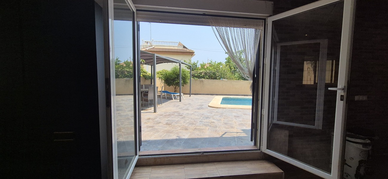 Pool area in villa for sale in Villamartin
