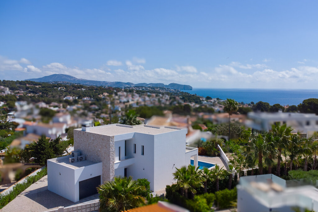 Beautiful luxury new-build villa with sea views for sale in La Fustera, Benissa &10; &10; This exclusive new-build villa combines modern architecture with Mediterranean accents and is situated on an exceptionally spacious and completely flat plot of 1,715