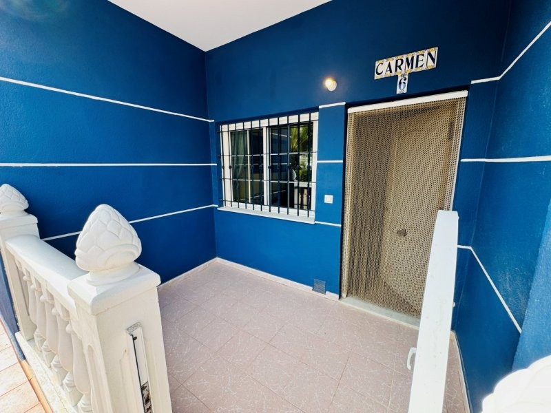 This property is located in La Mata, a residential complex with a communal swimming pool