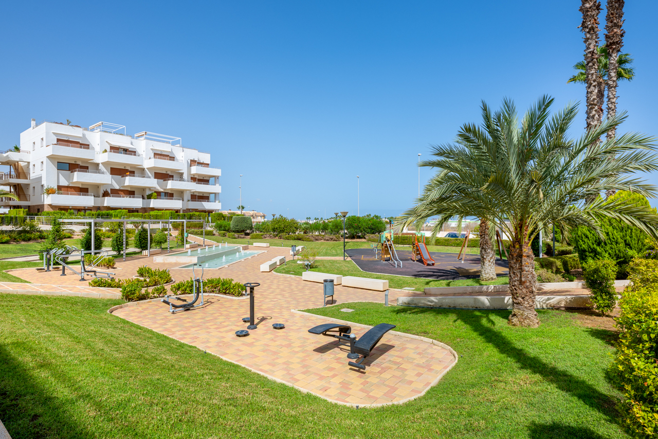 Pool area in apartment for sale in Cabo Roig