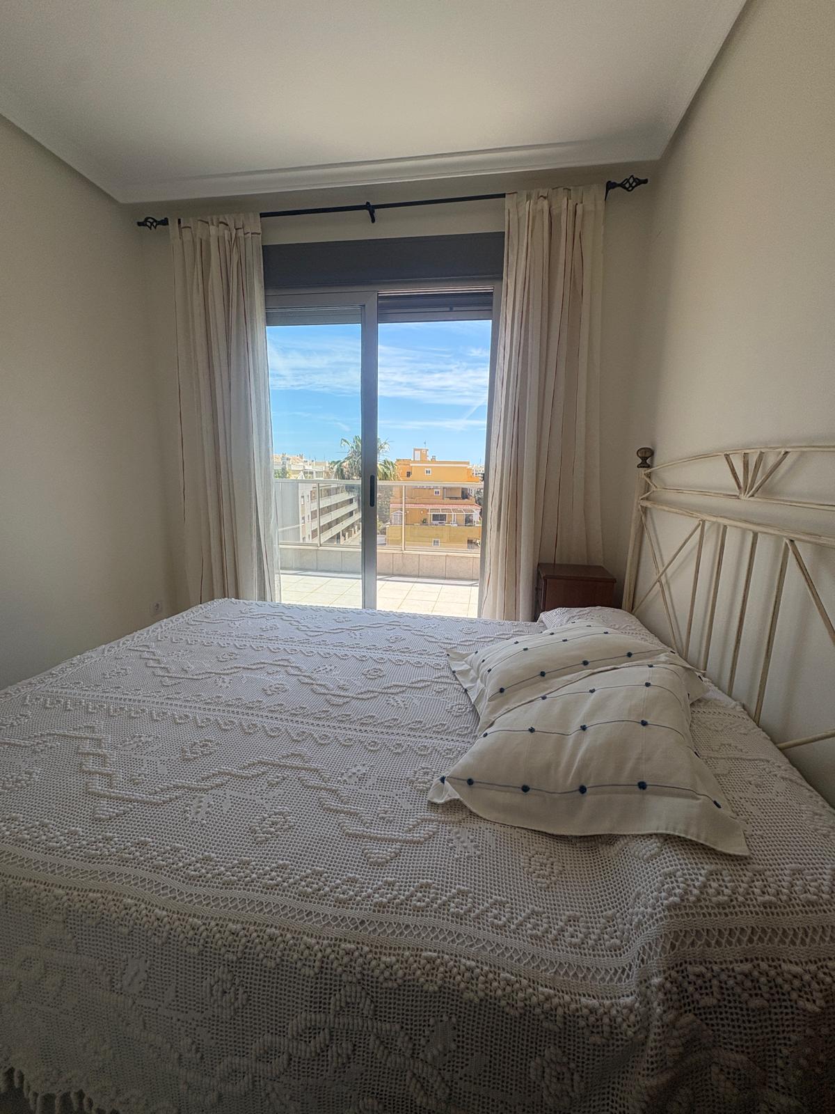 Living room in penthouse for sale in Denia