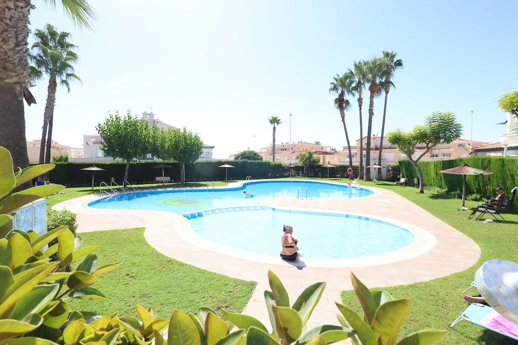 Zenia Mar III: 74 sqm ground-floor bungalow featuring a large 25 sqm paved terrace and garden with barbecue