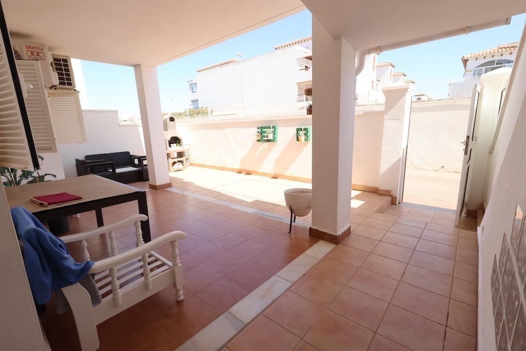 Zenia Mar III: 74 sqm ground-floor bungalow featuring a large 25 sqm paved terrace and garden with barbecue