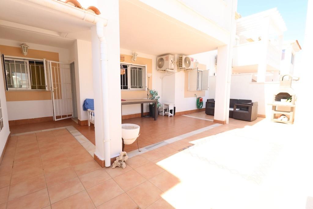 Zenia Mar III: 74 sqm ground-floor bungalow featuring a large 25 sqm paved terrace and garden with barbecue