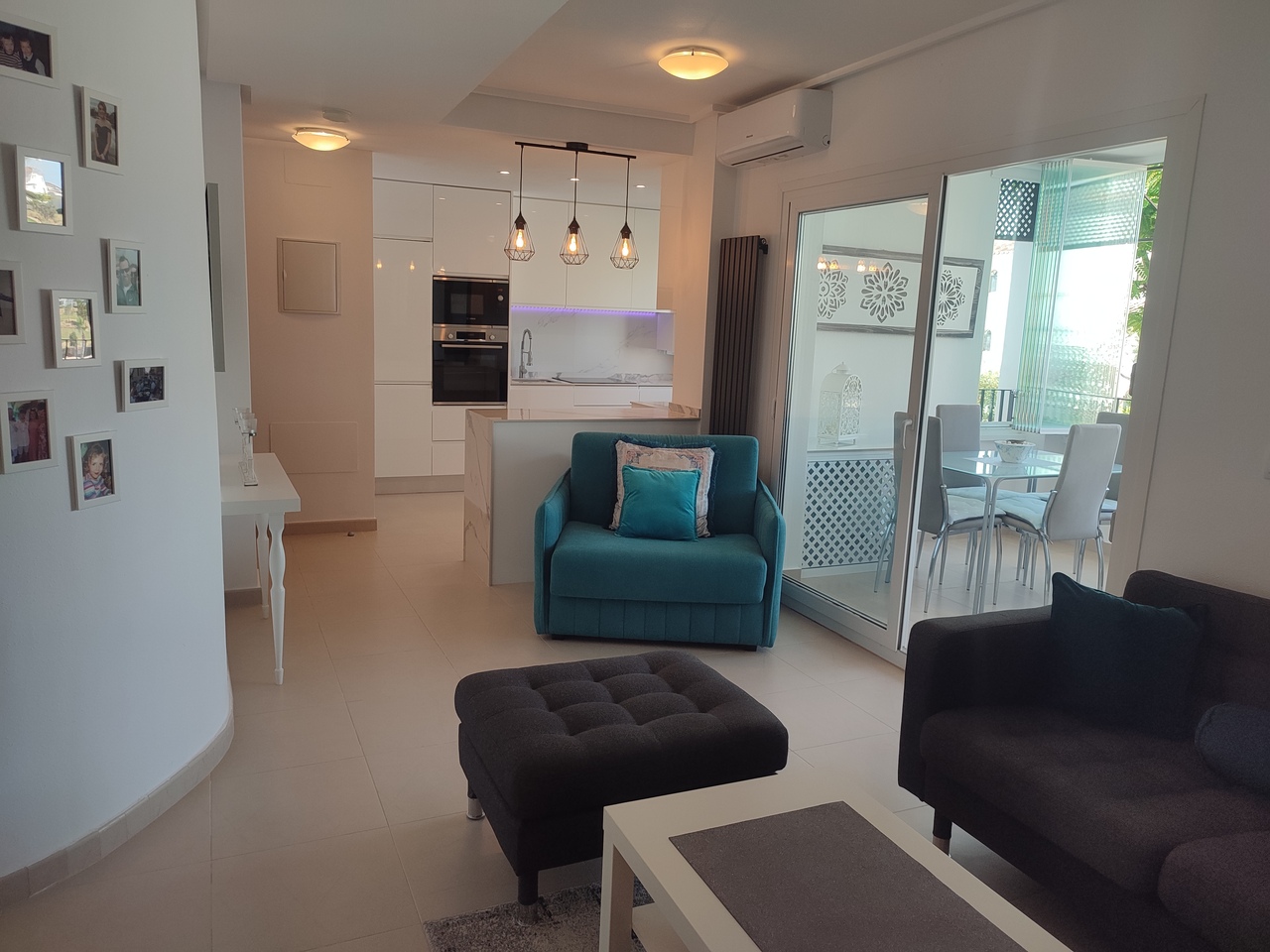 This popular curved wall design apartment has an attractive view of the swimming pool from its spacious terrace with pleanty of room for garden furniture and table & chairs